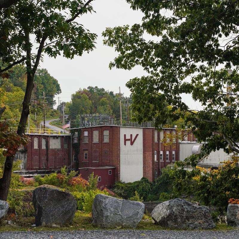 view of a building through the woods